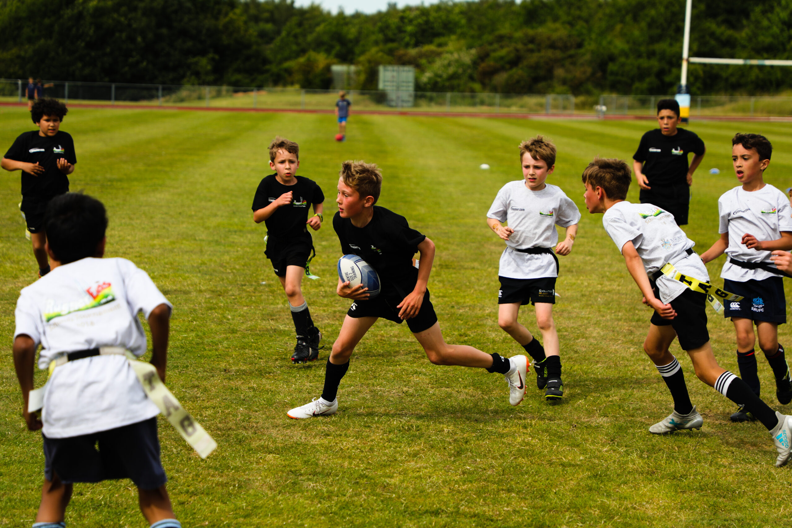 Home 5 Evo Rugby player carrying the ball at pace