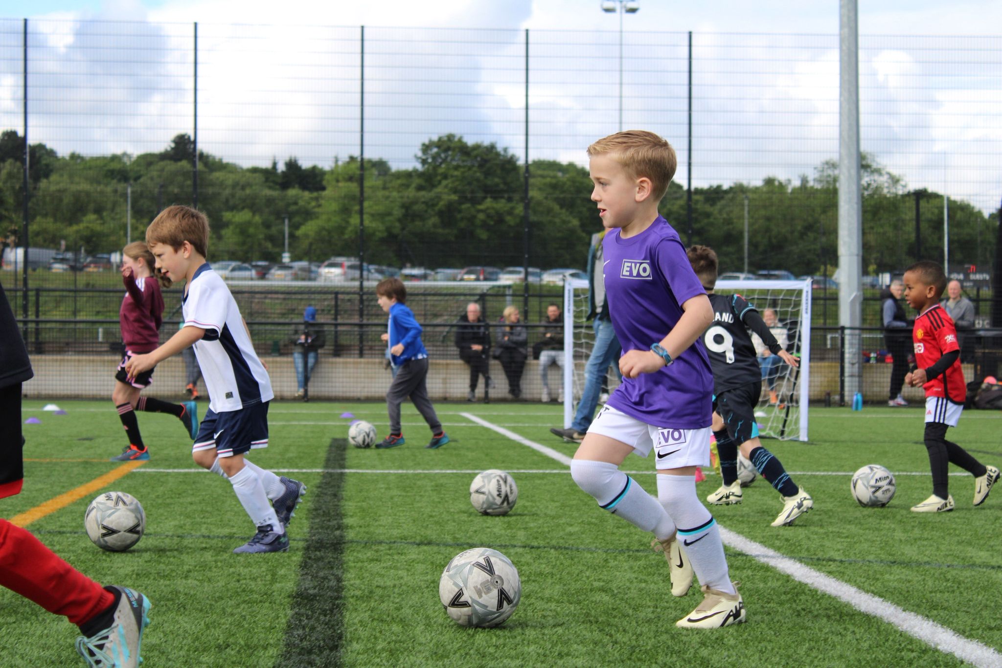 Home 3 Evo Soccer players in purple Evo kit